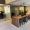 community co-working area with private offices and large table with seating