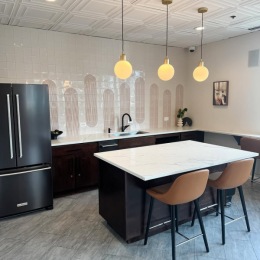 Access to resident-only features community kitchen with seating and large island