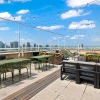 rooftop patio with view of a city