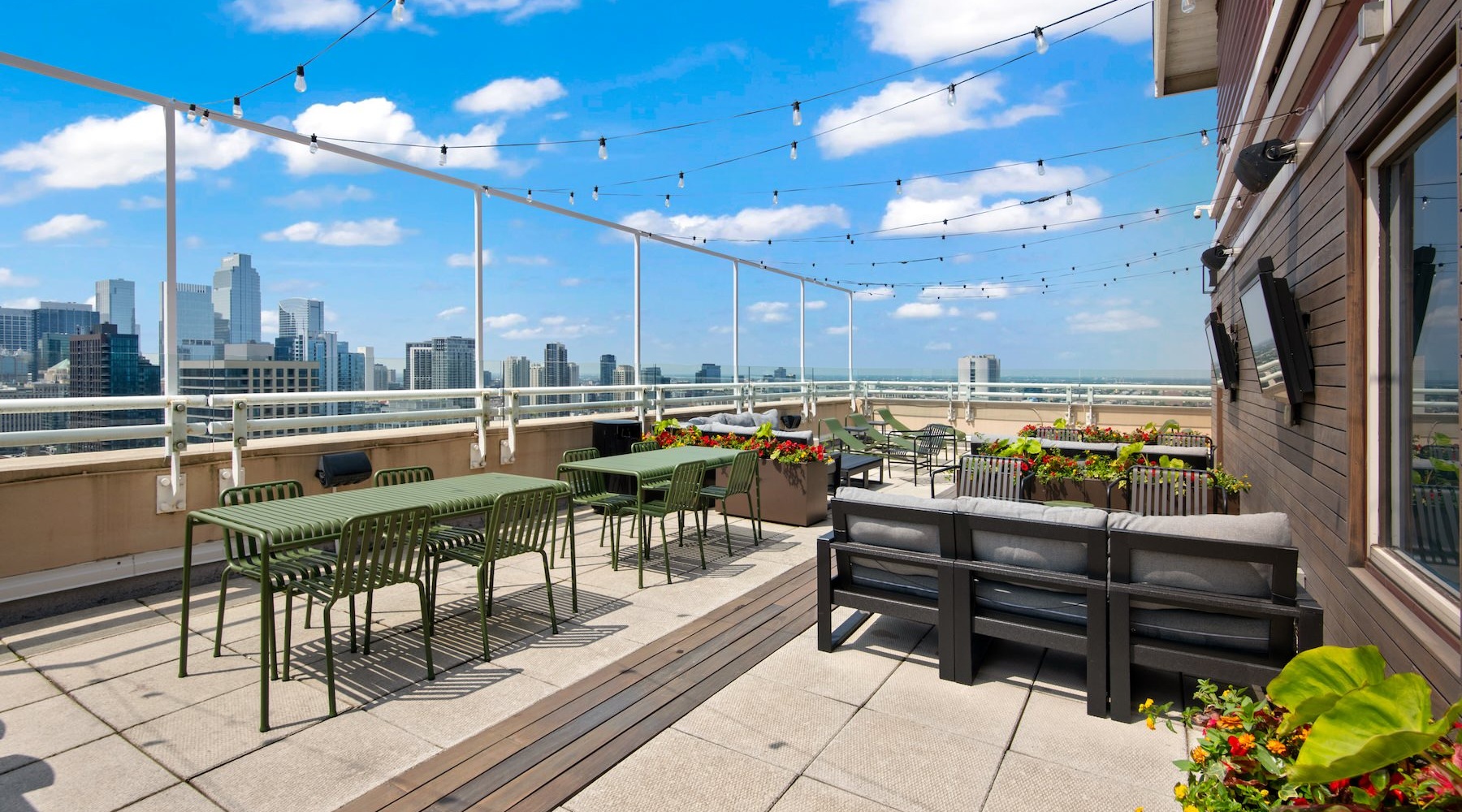rooftop patio with view of a city