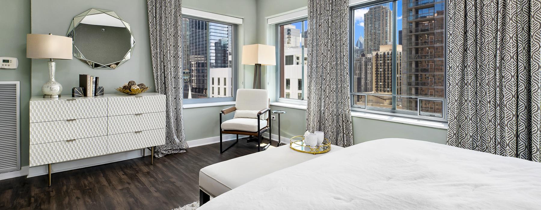 a bedroom with a bed and a chair