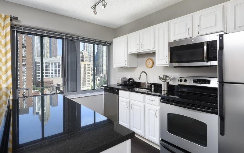 a kitchen with white cabinets