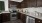 a kitchen with wooden cabinets